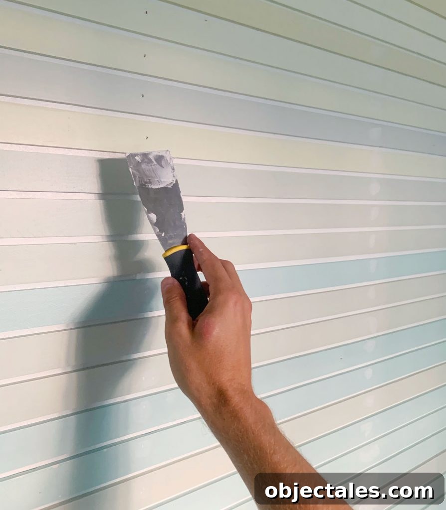 How to Create a Colorful Wood Accent Wall 16 Hand Spackling Nail Holes On Striped Wall Treatment