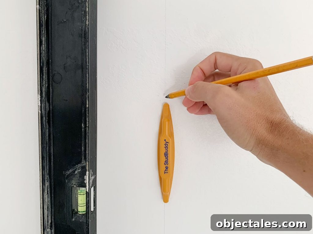 How to Create a Colorful Wood Accent Wall 10 Hand Marking Vertical Level Line On Wall Using StudBuddy Stud Finder