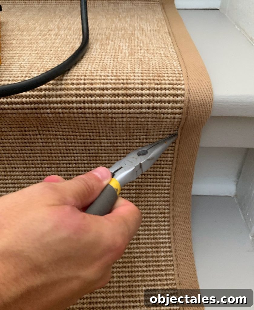 Needlenose Pliers Removing Staple On Sisal Stair Runner