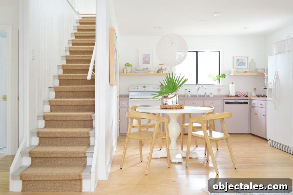 Kitchen With Mauve Cabinets And Stairs With Sisal Runner
