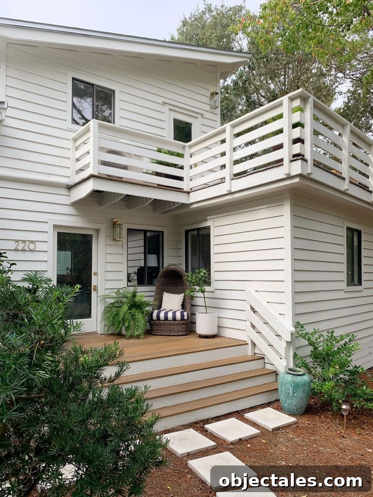 Two Levels Of Porches On White House With Horizontal Railings