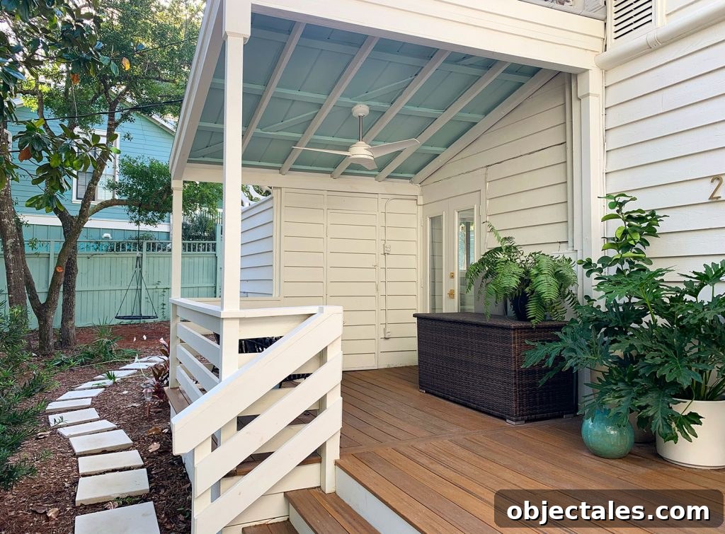 Covered Porch With Painted Blue Ceiling And White Ceiling Fan