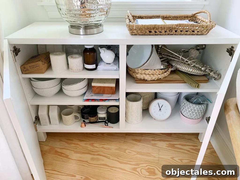 How to Build a Custom Media Cabinet with IKEA Besta 14 Besta Cabinet Opened With Various Decor Accessories On Shelves