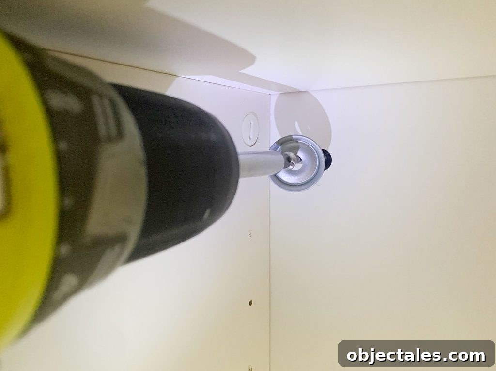 How to Build a Custom Media Cabinet with IKEA Besta 8 Screwdriver Installing Screw To Secure Ikea Besta Cabinet To Wall