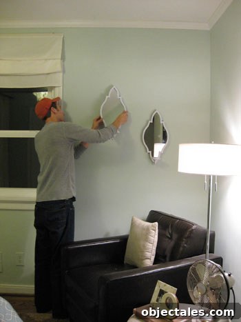 john-hangs-the-sconces-on-the-wall john-hangs-the-sconces-on-the-wall