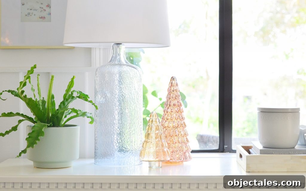 Holiday Decorating Ideas for Downsized Homes 10 Lighted Glass Christmas Trees On Entry Tabletop