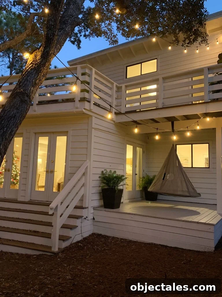 How to Paint a Porch Floor: Prep, Paint, and Finish 2 Exterior of white house at night with hanging tent swing on covered side porch
