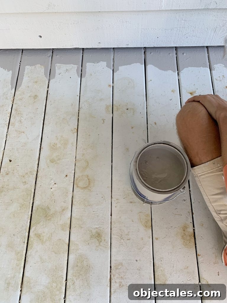 How to Paint a Porch Floor: Prep, Paint, and Finish 4 White painted porch floor stained with leaf marks