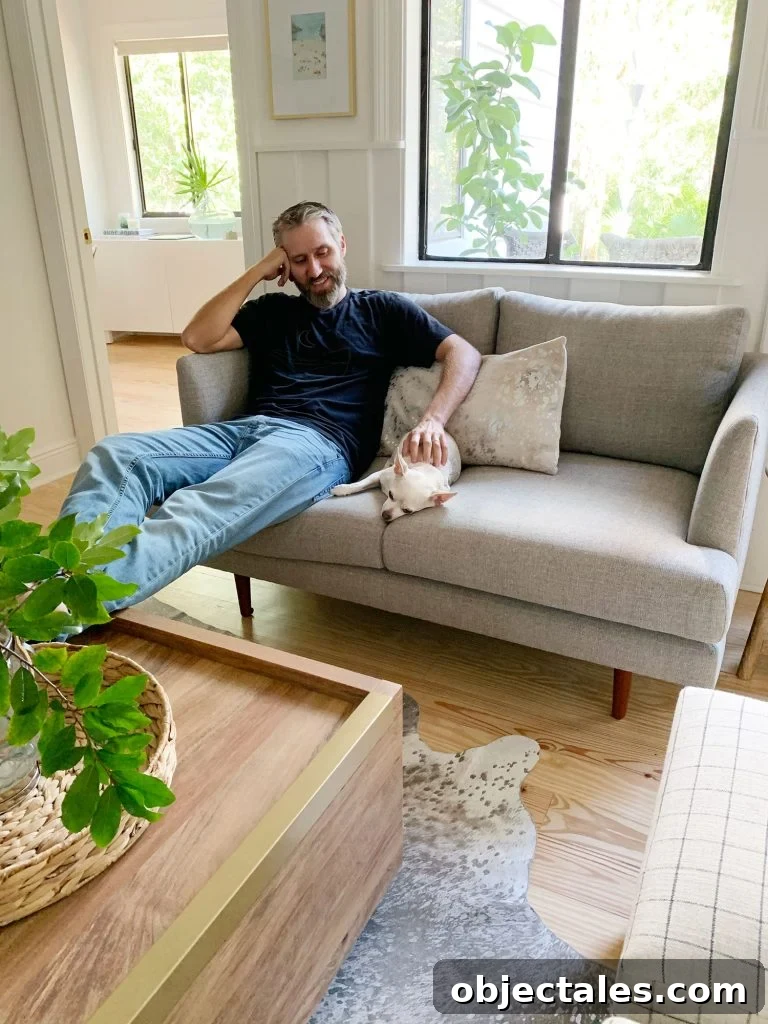 Choosing the Perfect Loveseat for Your Sitting Room 11 John sitting on gray loveseat with chihuahua next to him