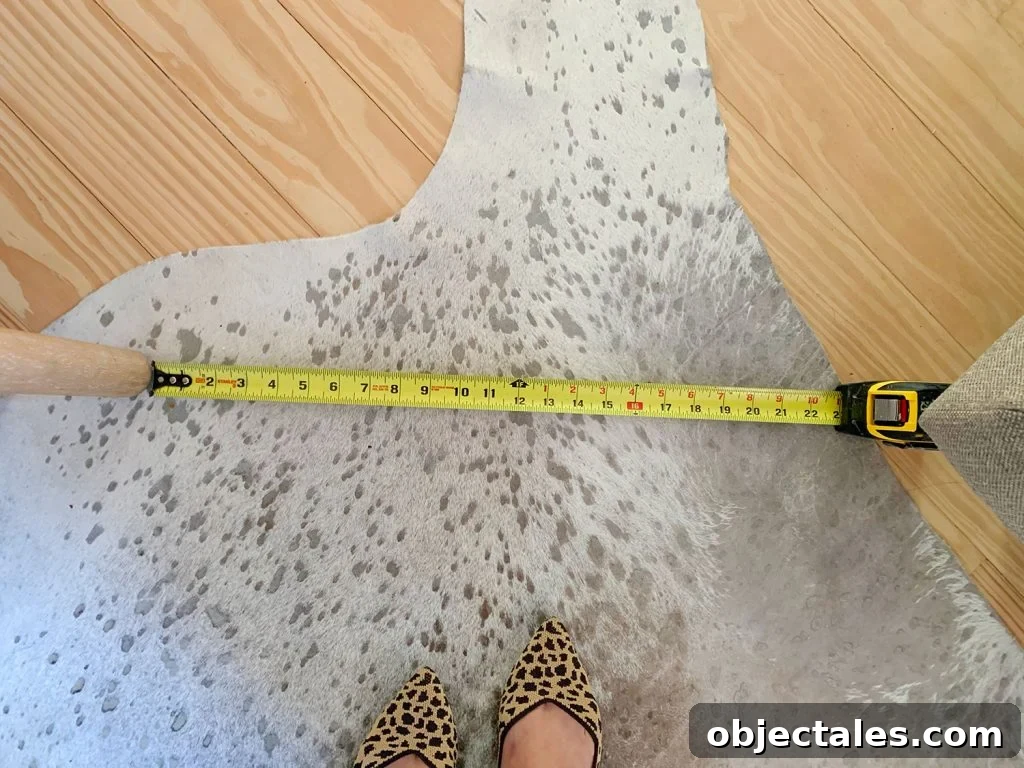 Find the Perfect Loveseat for Your Sitting Room 9 Measuring tape showing walking space between pieces of furniture in sitting area