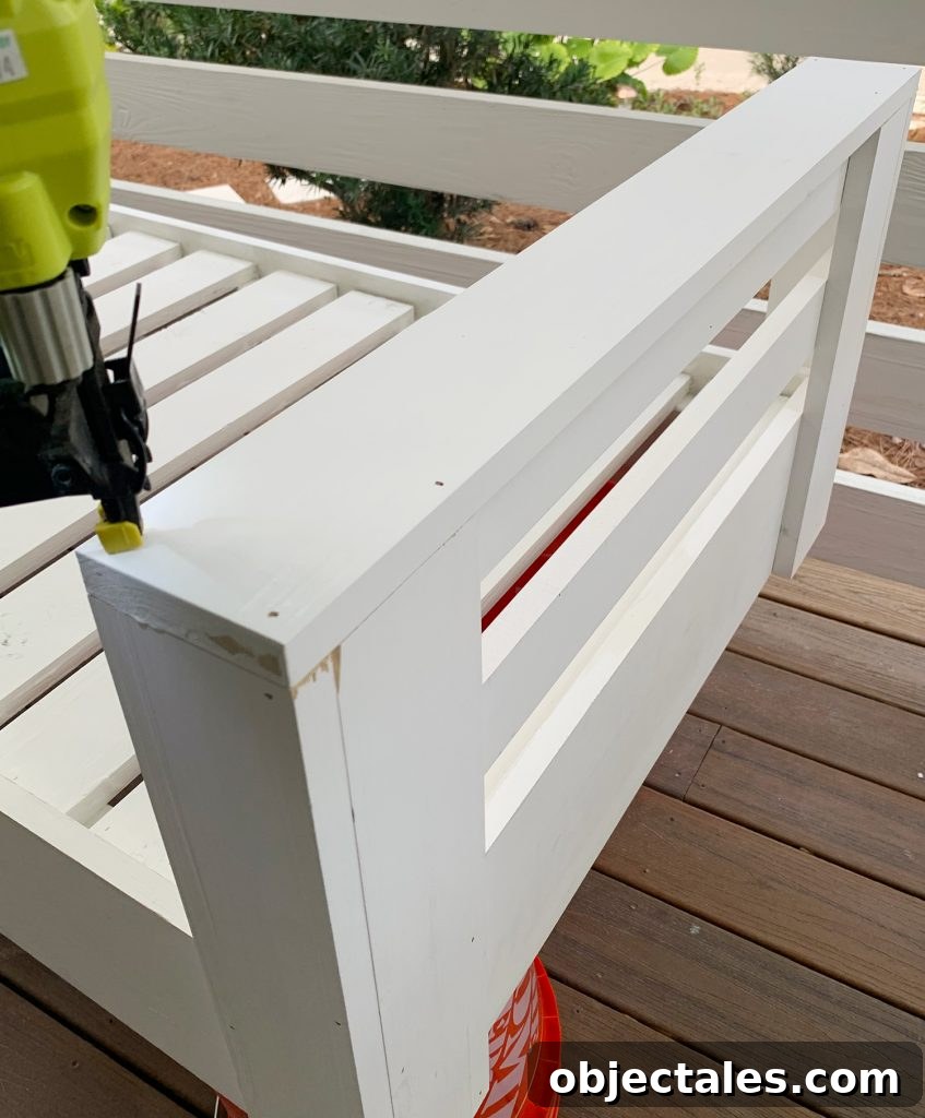 Build a Hanging Daybed: Step-by-Step DIY Tutorial 16 Nailing top piece to daybed arm