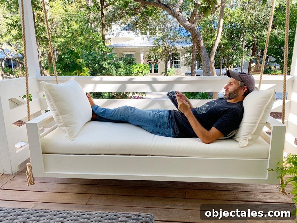 Build a Hanging Daybed: Step-by-Step DIY Tutorial 21 John Laying Fully Stretched Out On Hanging Daybed Swing