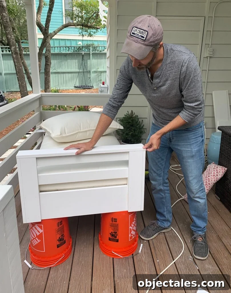 John constructed one side arm on hanging daybed