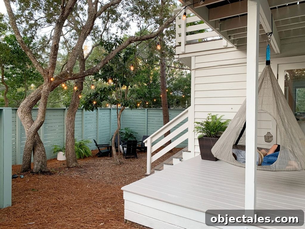 Create a Cozy Fire Pit Area for Outdoor Gatherings 16 View of side yard and covered side porch with hanging tent swing