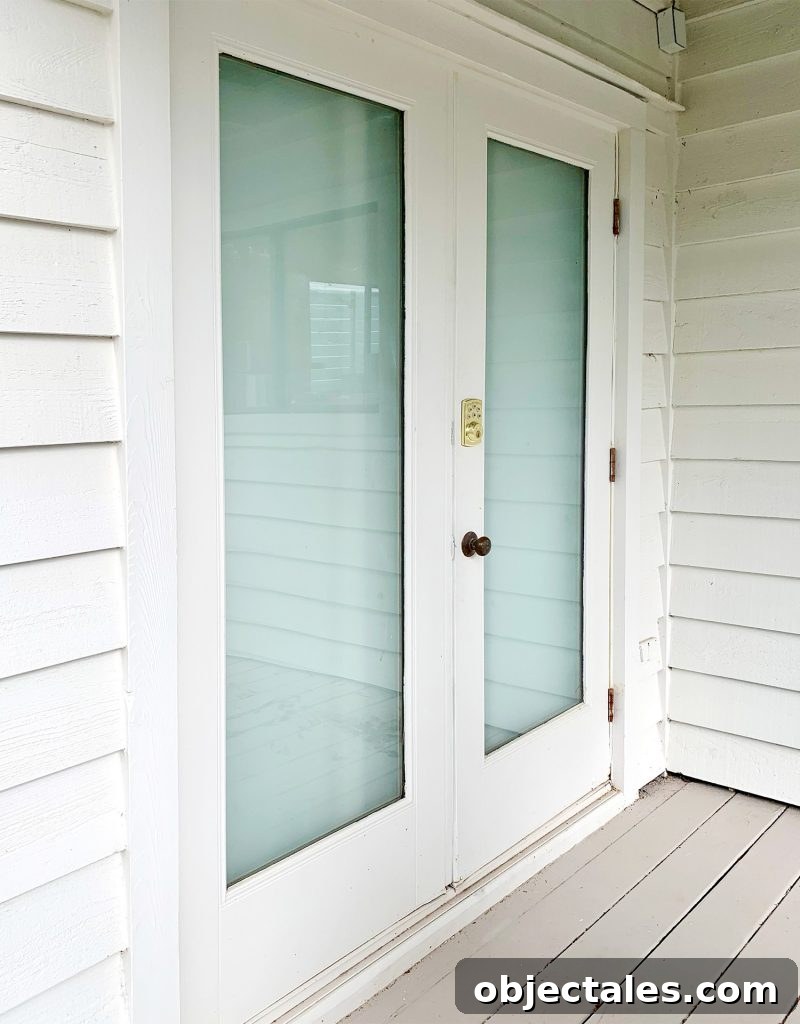 French doors viewed from outside that have been drywalled over