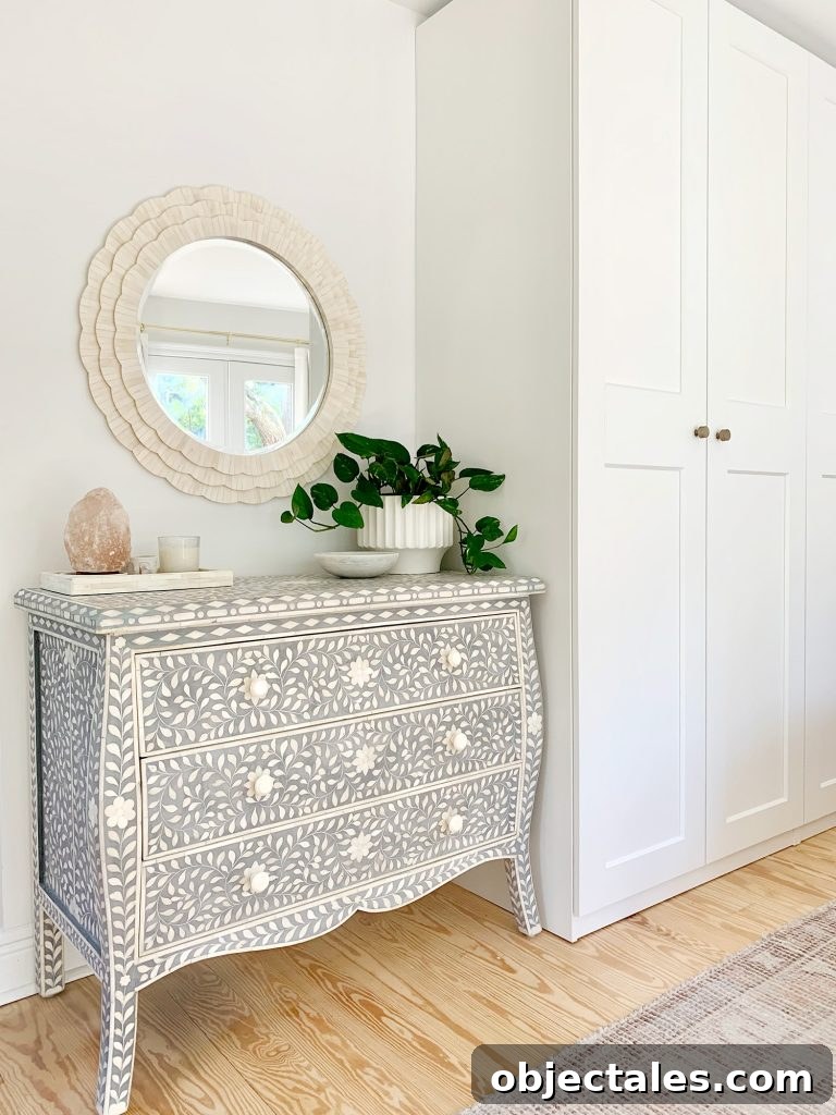 Blue inlay dresser next to Ikea Pax wardrobes with white bone inlay mirror