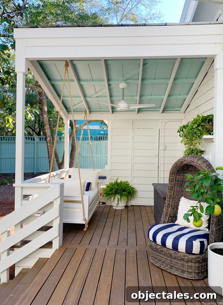 Before and After Home Photos: 14 Months of Renovation 27 Finished White Hanging Daybed Under Covered Front Porch