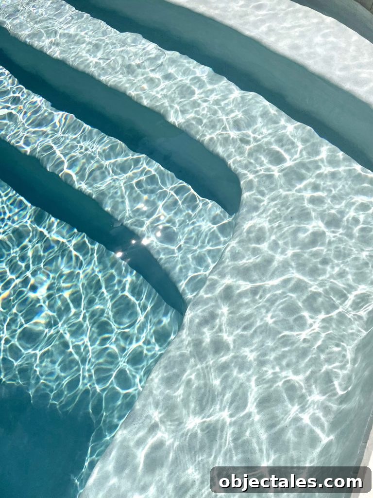 Detail photo of pool color getting darker as water gets deeper at steps Ivory DiamondBrite