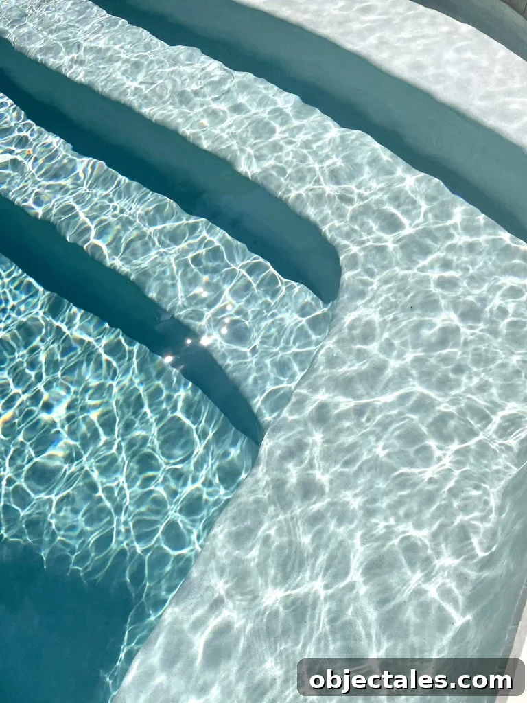 Detail photo of pool color getting darker as water gets deeper at steps Ivory DiamondBrite