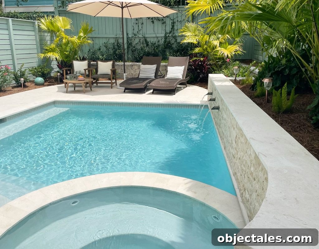 View of curved tile accent retaining wall covered in stone with fountains into pool