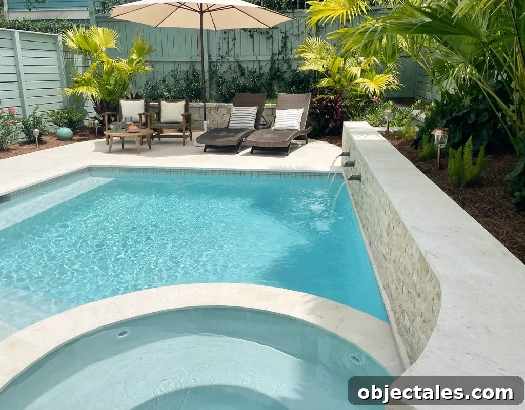 View of curved tile accent retaining wall covered in stone with fountains into pool