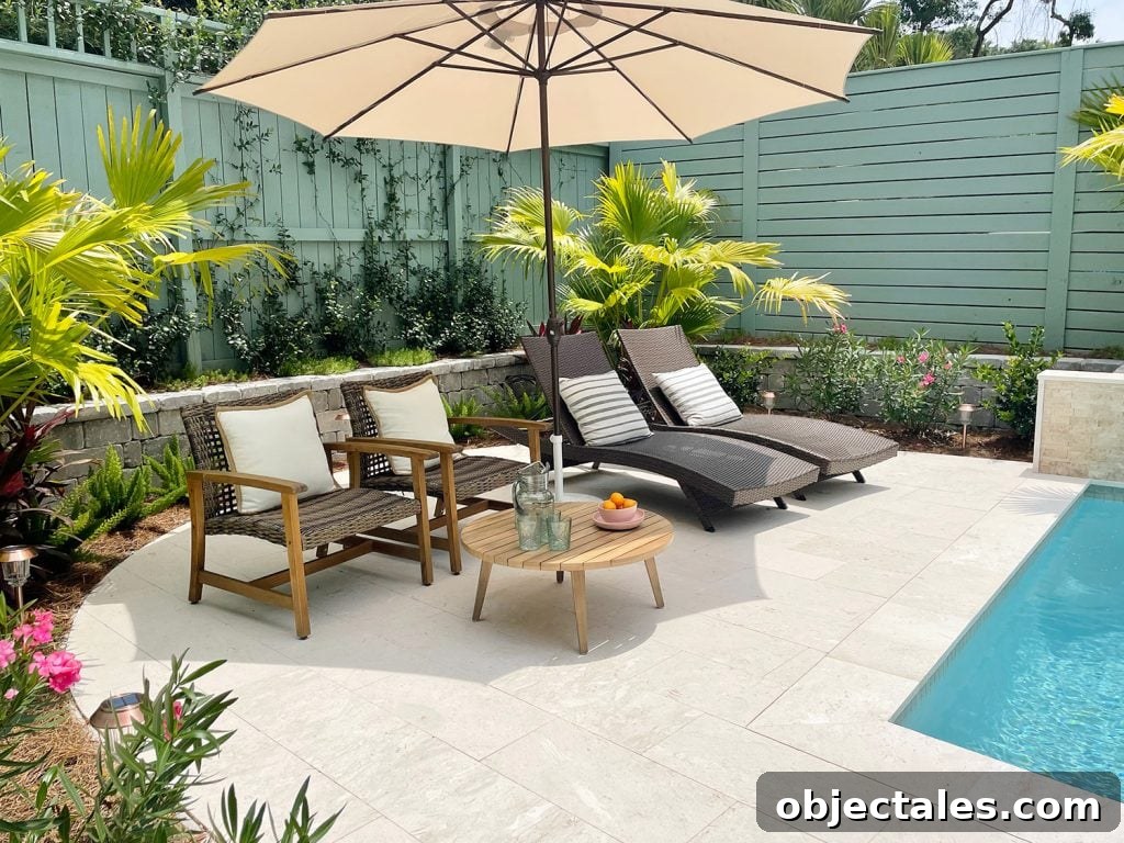 Round pool patio area surrounded by tropical plantings Chinese palms oleander jasmine stonecrop foxtail ferns