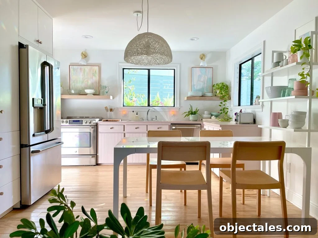 Closer View Of Beachy Kitchen From Sitting Area With Dining Table And Built In Pantry