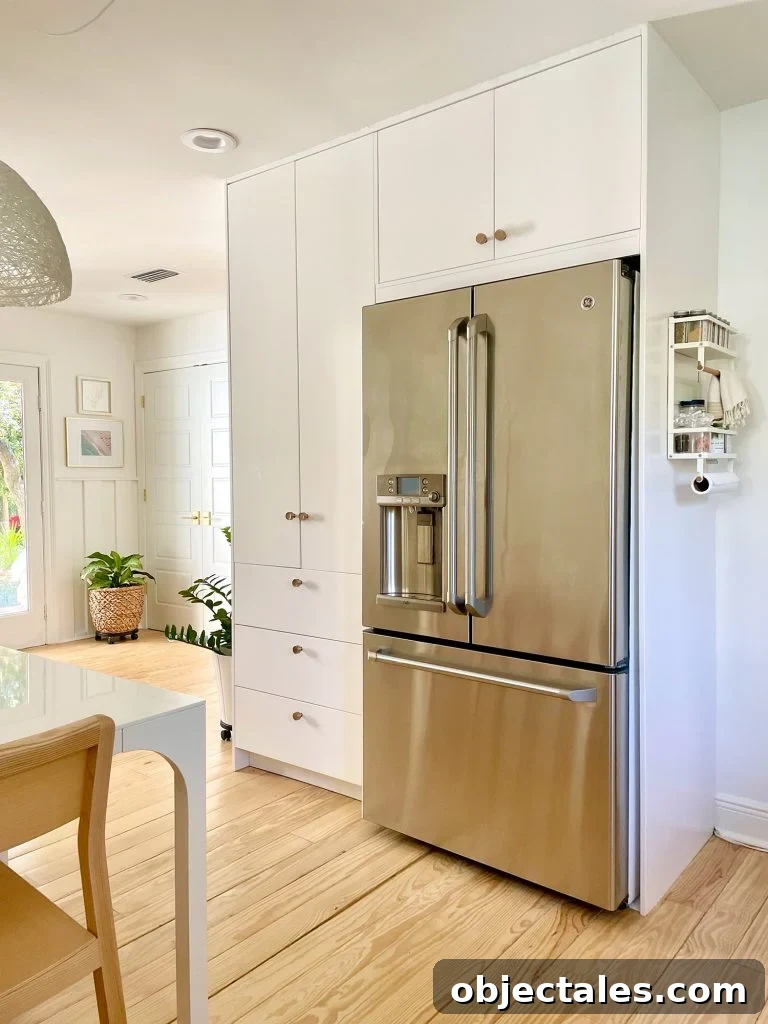 Ikea Built-In Pantry Cabinets Around Stainless Steel Refrigerator