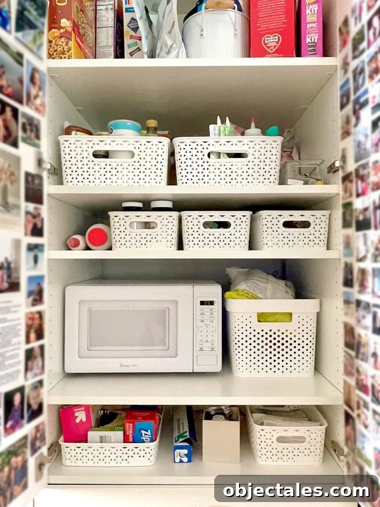 Close Up Shot Of Pantry Shelves With Baskets And Microwave