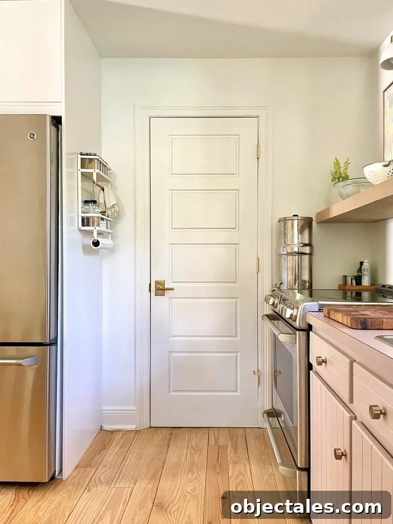 White Door To Kitchen Utility Closet With Spice Rack On Pantry Side