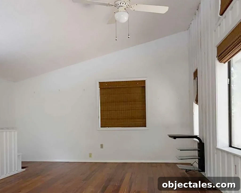 Family Room as Office, Art Studio, and Home Theater 6 Before Photo of Upstairs Family Room With Vaulted Ceilings And Window BLinds
