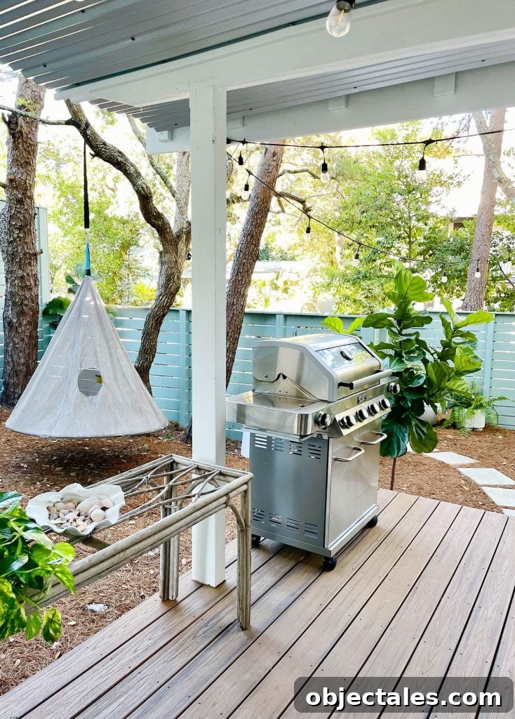 View of side yard with hanging swing and grill
