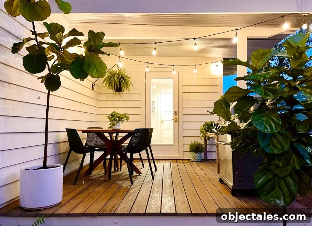 Viewing of dining table on covered kitchen porch under the glow of string lights