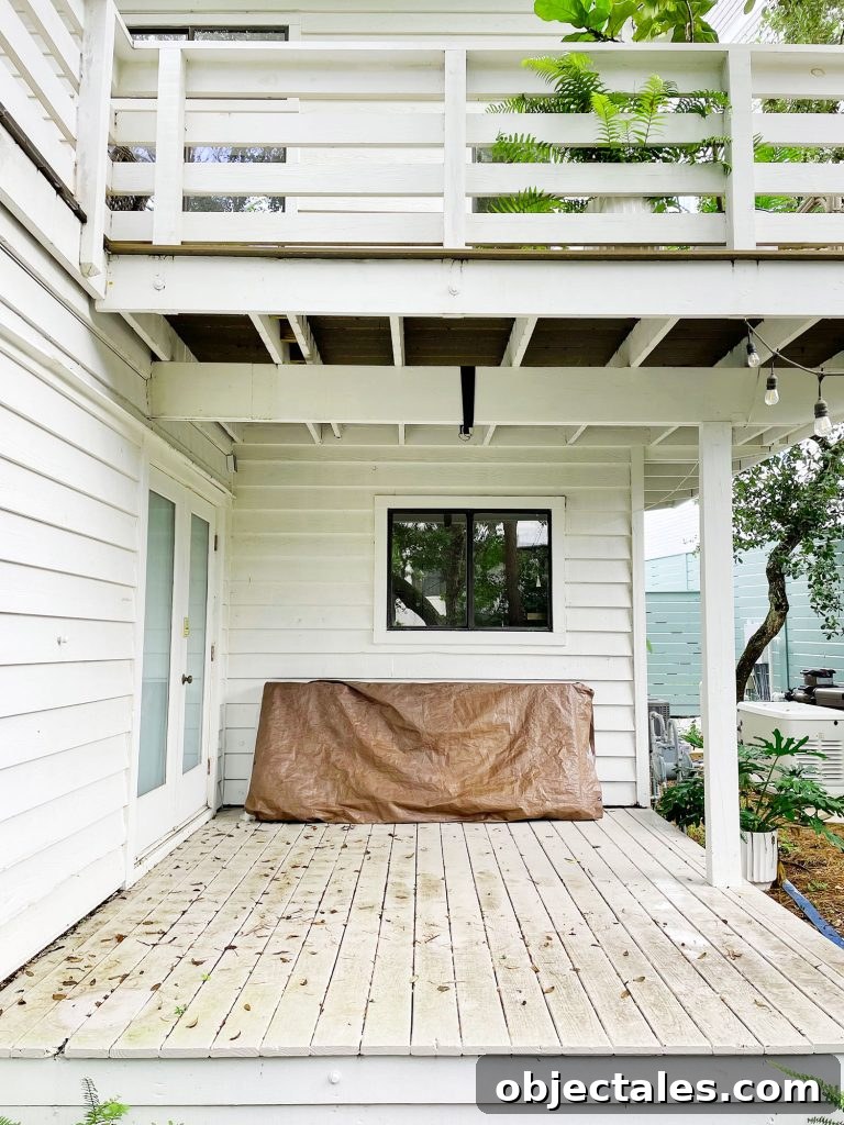 Midpoint photo of cover porch with stained painted floor and no furniture
